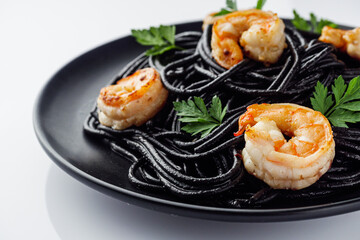 delicious black spaghetti pasta on a white background