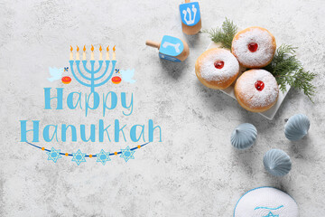 Obraz na płótnie Canvas Greeting card for Hanukkah with sufgania, dreidels and Christmas decor on light background