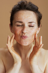 young 40 years old woman with face scrub