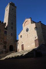 Obraz premium Dusk at church Santa Maria Assunta in San Gimignano, Tuscany Italy