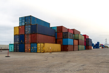 Cargo containers. Cargo container yard. Stack of freight containers at the docks. Industrial yard. Import and export logistic concept.