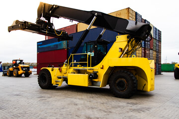 Container handlers. Forklift truck in shipping yard. Industrial container logistic yard. Logistics import export concept.