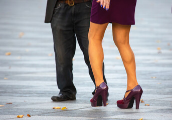 Feet of dancing couples on the street