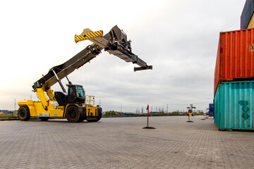 Container handlers. Forklift truck in shipping yard. Industrial container logistic yard. Logistics...