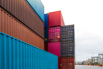 Cargo containers. Cargo container yard. Stack of freight containers at the docks. Industrial yard. Import and export logistic concept.