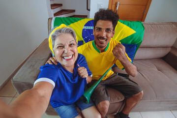 Mother and Son Celebrating the Cup in the living room watching TV cheering for Brazil.