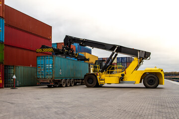 Container handlers. Forklift truck in shipping yard. Industrial container logistic yard. Logistics...