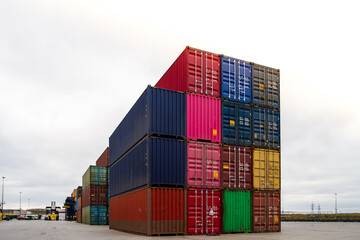 Cargo containers. Cargo container yard. Stack of freight containers at the docks. Industrial yard. Import and export logistic concept.