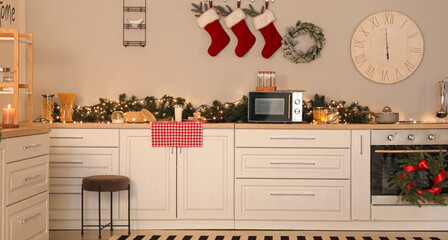 Interior of light kitchen decorated for Christmas
