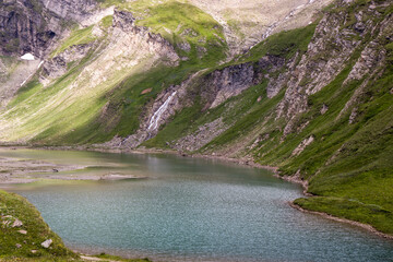The beautiful view of Nassfeld Speicher lake. High Tauern National Park, Carinthia, Austria. Close...