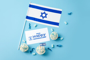 Flag of Israel, cupcakes and card with text HAPPY INDEPENDENCE DAY on color background