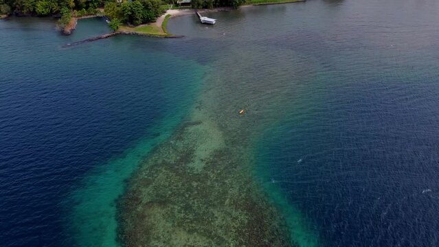 Aerial reef zoom in to snorkleing