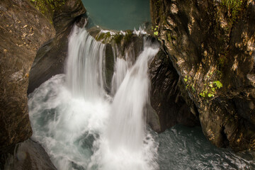Obraz premium The beautiful view of Sigmund Thun Gorge - Sigmund Thun Klamm. Cascade valley of wild Kapruner Ache near Kaprun, Austria. Crystal clear blue water. 4K background, HD wallpaper.