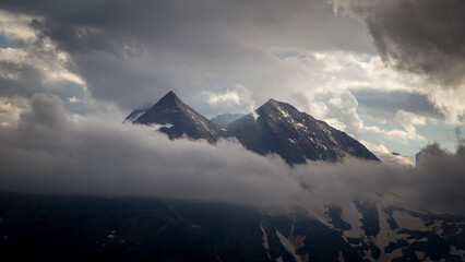 The beautiful panoramic view of mountain top shrouded in clouds. Grossglockner High Alpine Road. Grossglockner Hochalpenstrasse, Austria, Europe. High Tauern National Park. HD wallpaper, 4k background