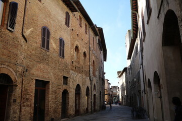 Old narrow alley in San Gimignano, Tuscany Italy