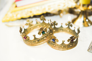 Golden crowns lying on the table in church