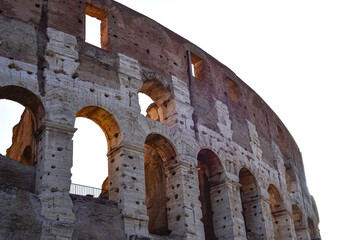 Obraz premium Colosseum at sunset in Rome, Italy. The Colosseum in city of Rome at sunset in Italy, ancient Flavian Amphitheatre and Gladiators stadium.