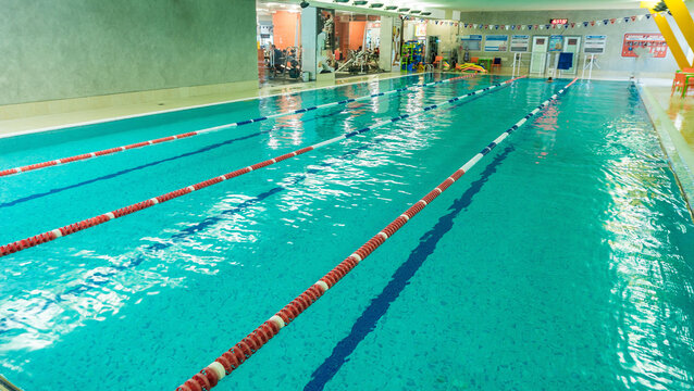 Swimming pool with hand rails at the leisure center - Powered by Adobe
