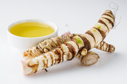 fresh yarrow root on a white acrylic background