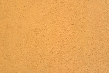 Orange Abstract Background. Painted Orange Color Stucco Wall Texture With Copy Space. Bright Art Wallpaper. Abstract grunge surface orange gold background golden yellow highlights