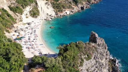 Aerial drone top down photo of tropical exotic paradise secluded rocky bay with deep turquoise sea forming a blue lagoon