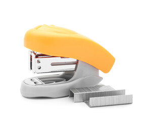 Orange stapler and staples on white background