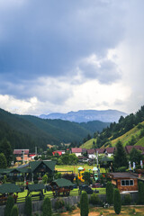 Moeciu de Sus, Romania,  30th of July 2022 - Landscape of mountains and cottage complex