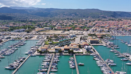 Obraz premium Aerial drone photo of famous main town of Lefkada island with traditional Ionian architecture and safe anchorage for yachts and sail boats, Greece