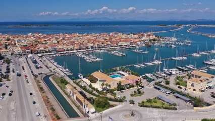 Fototapeta na wymiar Aerial drone photo of famous marina of Lefkada island town with anchored yachts and sailboats, Ionian, Greece