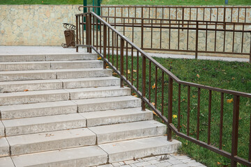 View of steps with railing in autumn park