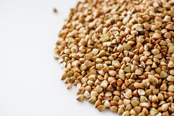 organic raw green buckwheat on a white background