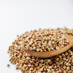 organic raw green buckwheat on a white background