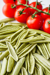 raw green cavatelli pasta on a white background