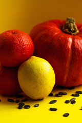 still life with pumpkin, lemon and tangerines