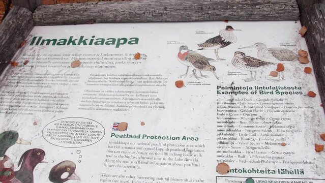 A bird information board in a bird path in Ilmakkiaapa nature protection area in Finland