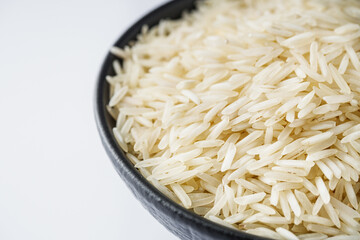 raw basmati rice on a white acrylic background