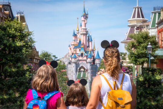 A mother and her daughters gaze at the Princess Castle the Disneyland Paris park. August 28, 2019, Paris, France