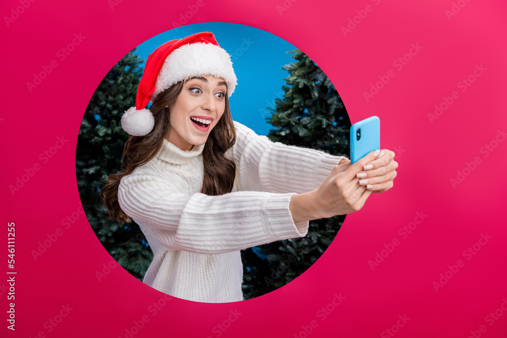 Sticker Photo of funny blogger girl hold telephone make selfie record video through hole red ad background