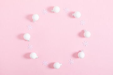 Christmas minimal composition. Xmas white decorations on  pastel pink  background. Christmas, New Year, winter concept. Flat lay, top view, copy space