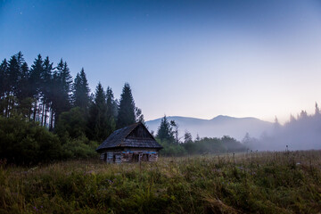 Dawn Under the Kralova Hola, Chamkova Stodola, Misty Morning and Old Wooden Hut in the Mountains © Filip