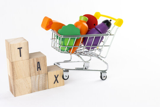 taxの文字とショッピングカート。消費税の増税イメージ