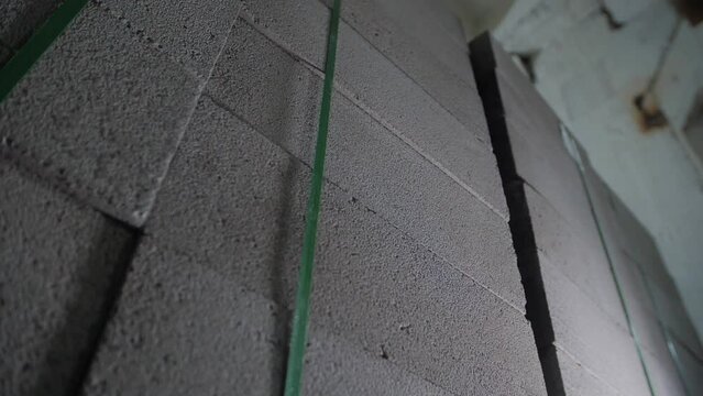 Aerated Concrete Production Plant. The gas block is at a construction site. Slow motion video with gas block pallet. 