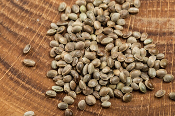 cannabis seeds on wooden board