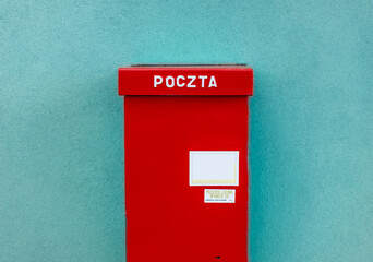 Red post box in Poland. Typical polish post symbol