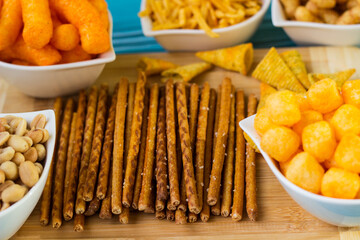 Salty snacks served as party food in bowls