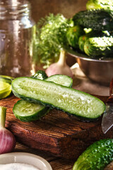 Fresh cucumbers, marinade ingredients, preparation for preservation. Fresh vegetables on a wooden table.