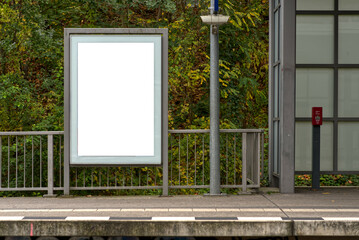 Blank white advertising poster at a train station.