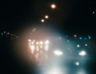 Fototapeta na wymiar night traffic on a foggy night