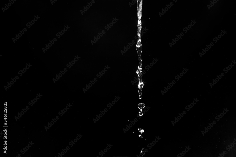 Sticker water splashes isolated on black background. white jets with drops