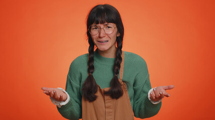 What Why. Sincere irritated adult woman raising hands in indignant expression asking reason of...